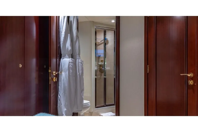 Slide: The Image of Luxurious bathroom on 1988 Van Mill 143 Tri-Deck Motor Yacht with wooden doors and shower. - 44