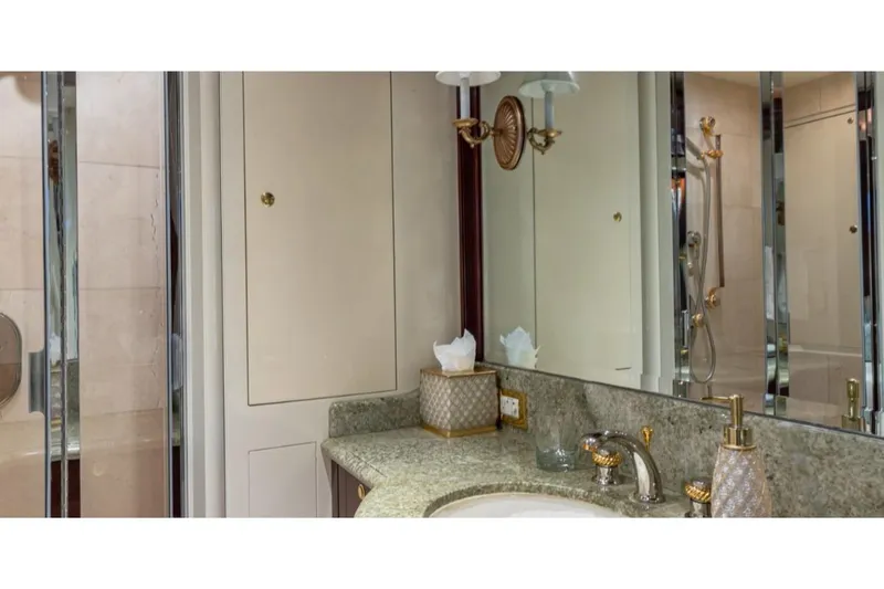 Slide: The Image of Luxurious bathroom on 1988 Van Mill 143 Tri-Deck Motor Yacht with elegant fixtures. - 45
