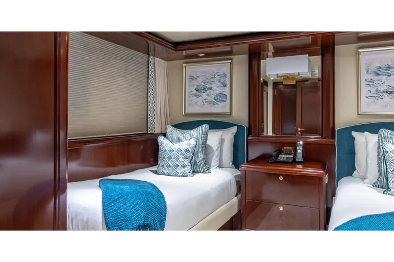 Slide: The Image of Luxurious twin cabin on 1988 Van Mill 143 Tri-Deck Motor Yacht with elegant wood finishes. - 46