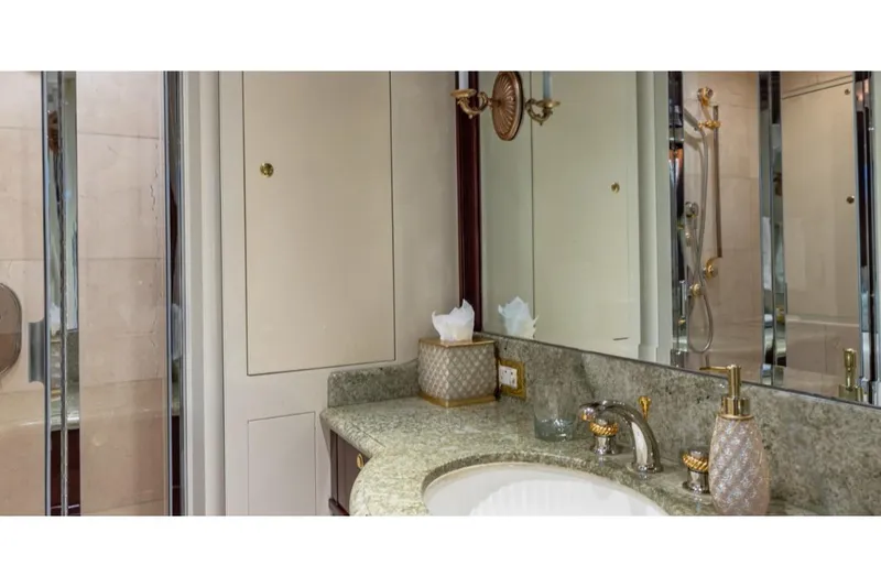 Slide: The Image of Luxurious bathroom on 1988 Van Mill 143 Tri-Deck Motor Yacht with elegant fixtures. - 49