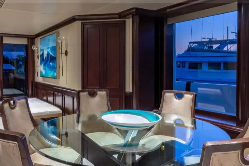 Slide: The Image of Luxurious dining area on 1988 Van Mill 143 Tri-Deck Motor Yacht with elegant decor. - 55