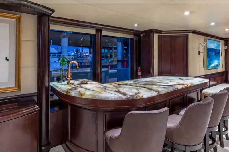 Slide: The Image of Luxurious yacht interior with elegant bar and marble countertop, Van Mill 143 Tri-Deck Motor Yacht, 1988. - 56