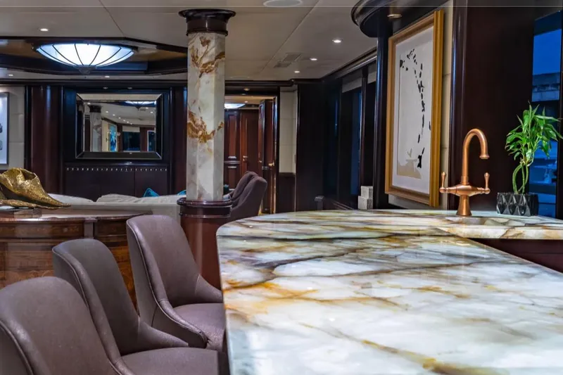 Slide: The Image of Luxurious interior of 1988 Van Mill 143 Tri-Deck Motor Yacht with elegant marble and wood finishes. - 57