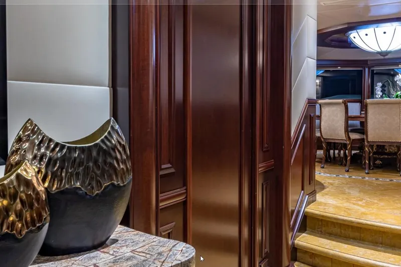 Slide: The Image of Luxurious interior of 1988 Van Mill 143 Tri-Deck Motor Yacht with elegant dining area. - 67