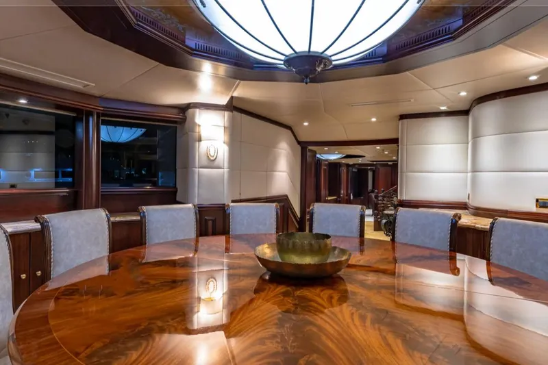 Slide: The Image of Luxurious dining area on 1988 Van Mill 143 Tri-Deck Motor Yacht with elegant wood table. - 69