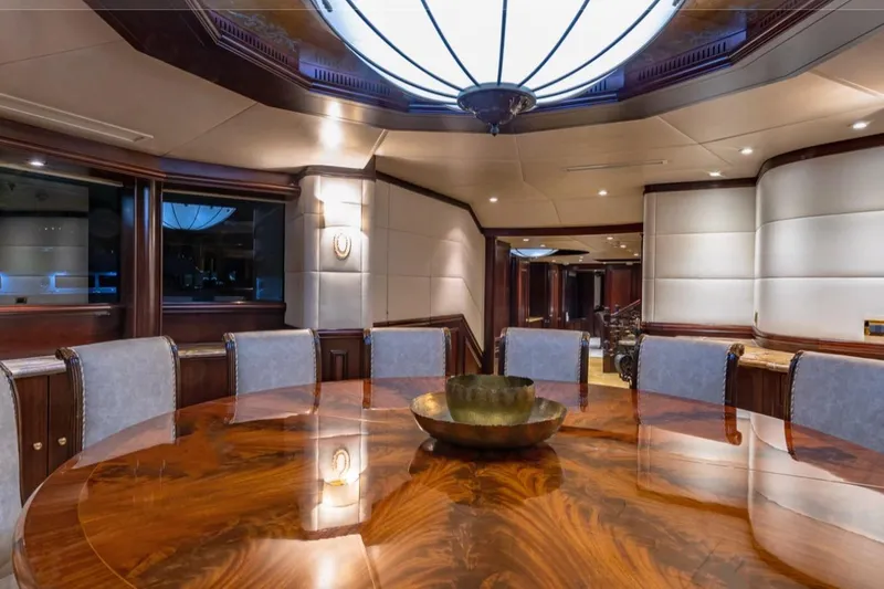Slide: The Image of Luxurious dining area on 1988 Van Mill 143 Tri-Deck Motor Yacht with elegant wood table. - 71