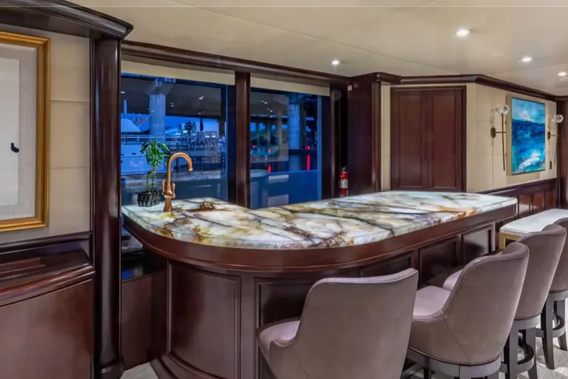 Slide: The Image of Luxurious interior of 1988 Van Mill 143 Tri-Deck Motor Yacht with elegant bar and seating. - 74