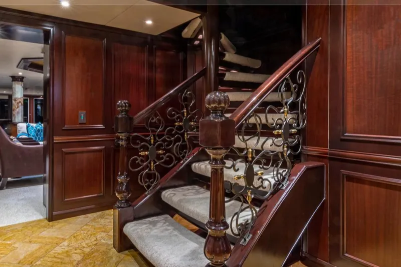 Slide: The Image of Luxurious wooden staircase with ornate railing on 1988 Van Mill 143 Tri-Deck Motor Yacht. - 76