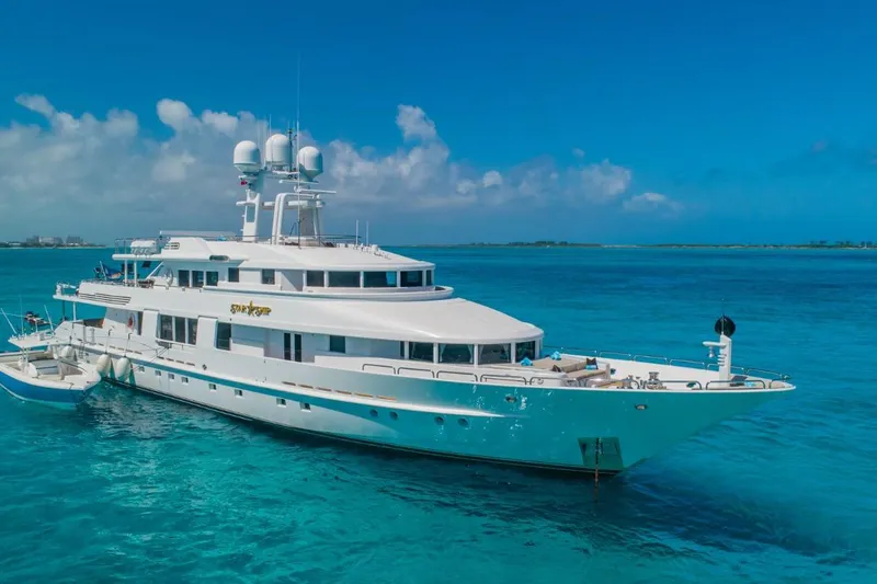 Slide: The Image of Luxurious 1988 Van Mill 143 Tri-Deck Motor Yacht on clear blue ocean waters. - 79