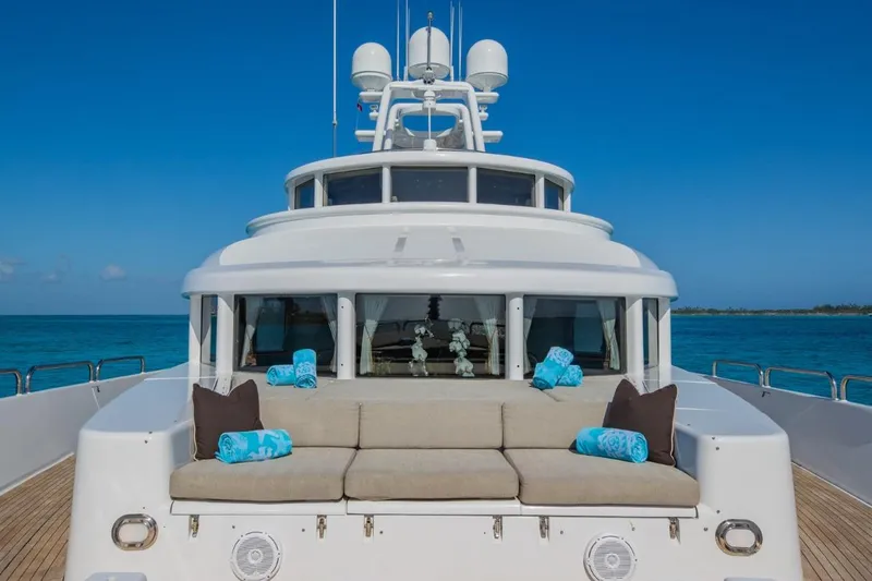 Slide: The Image of Luxurious 1988 Van Mill 143 Tri-Deck Motor Yacht with elegant deck seating and ocean backdrop. - 9