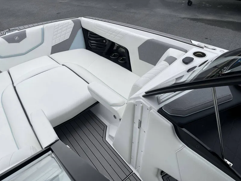 Slide: The Image of Interior of 2022 Nautique G25 with luxurious white seating. - 11