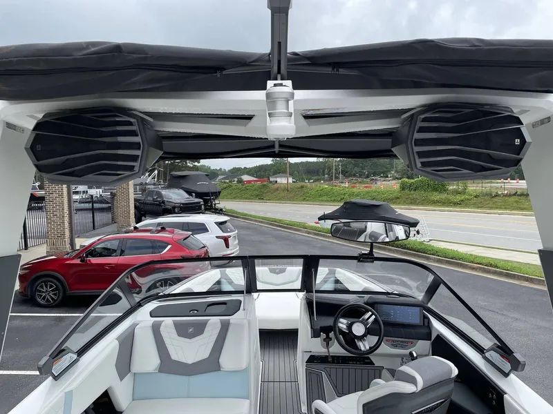 Slide: The Image of Interior view of a 2022 Nautique G25 boat with modern speakers. - 24