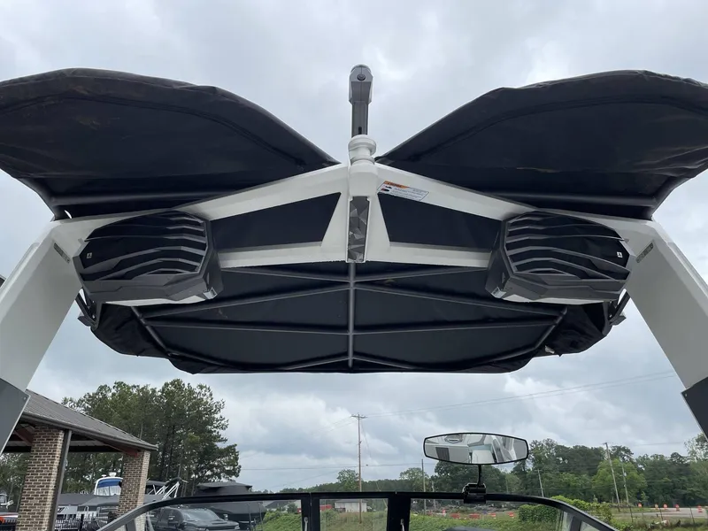Slide: The Image of Nautique G25 2022 boat with speakers and canopy. - 26