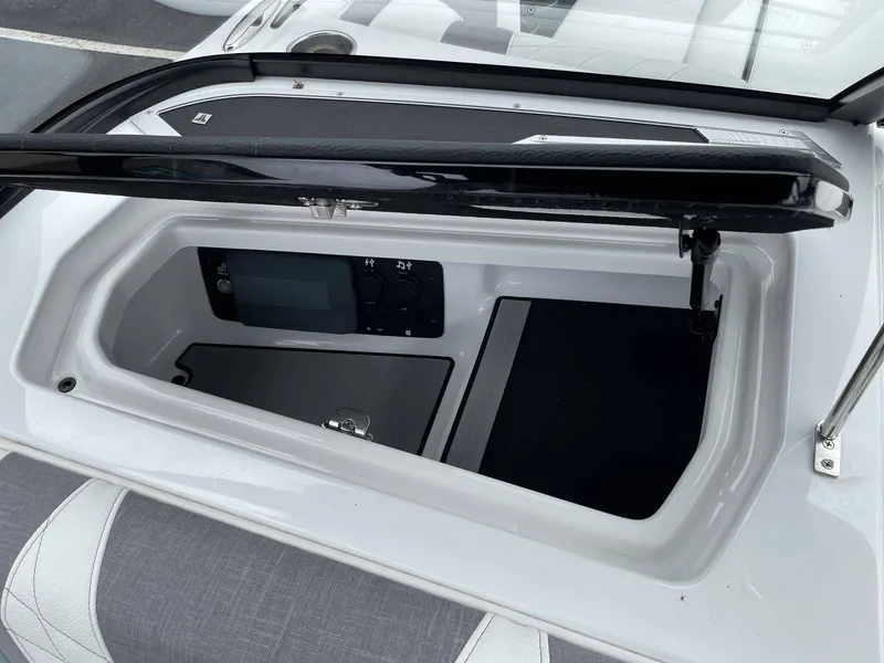Slide: The Image of Interior view of 2022 Nautique G25 boat storage compartment. - 29