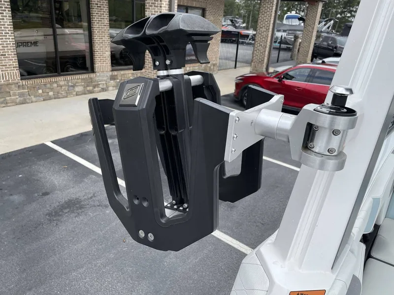 Slide: The Image of Nautique G25 2022 boat accessory in a parking lot. - 32