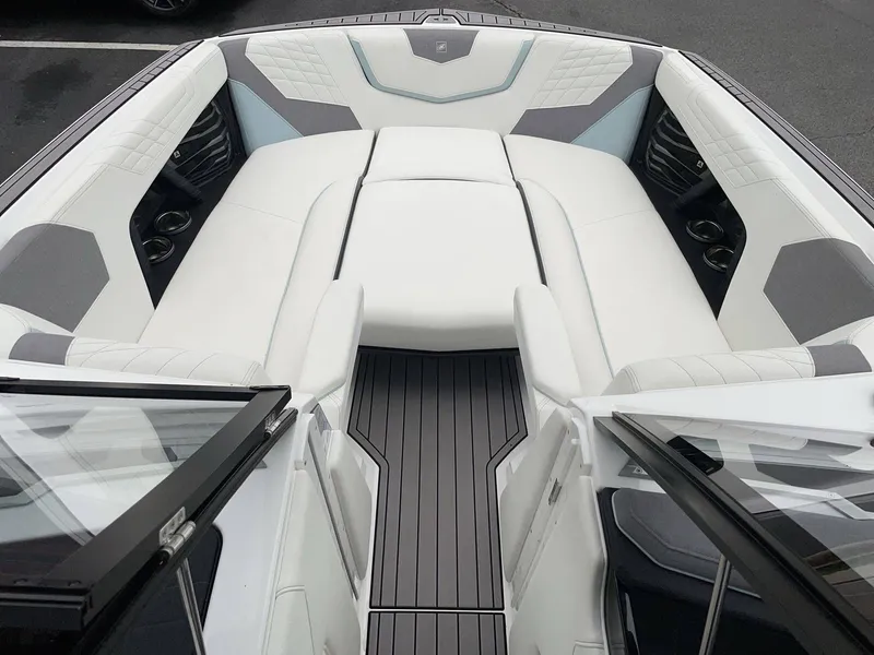 Slide: The Image of Interior of 2022 Nautique G25 with luxurious white seating. - 34