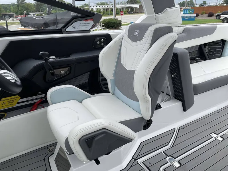 Slide: The Image of Interior of a 2022 Nautique G25 boat with luxurious seating. - 35