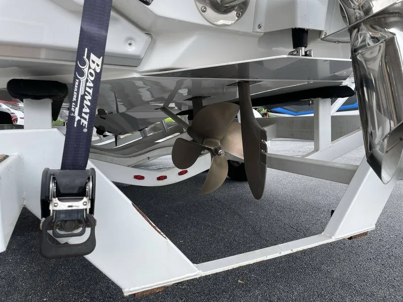 Slide: The Image of Nautique G25 2022 boat propeller and trailer view. - 37