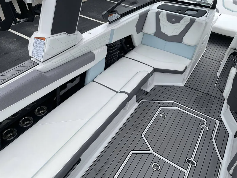 Slide: The Image of Interior of 2022 Nautique G25 with gray and white seating. - 4