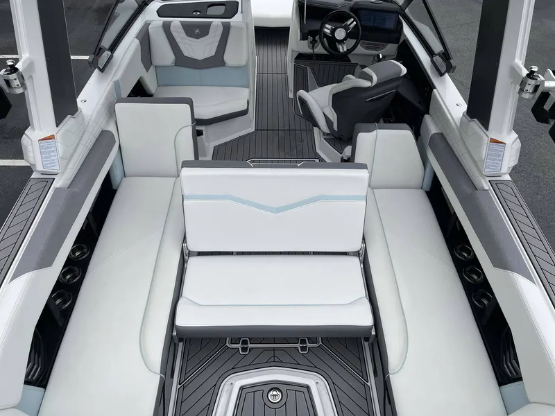 Slide: The Image of Interior of a 2022 Nautique G25 boat with luxurious seating. - 40