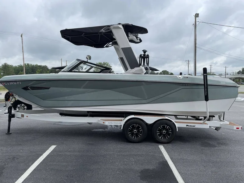 Slide: The Image of 2022 Nautique G25 boat on trailer, side view. - 41