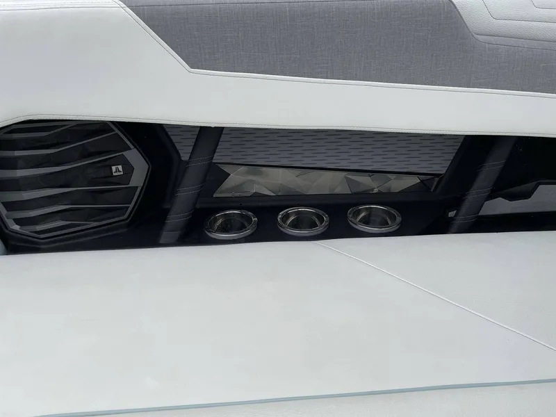 Slide: The Image of Interior of 2022 Nautique G25 with speaker and cup holders. - 42