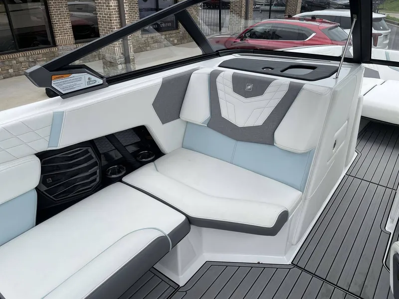 Slide: The Image of Interior of a 2022 Nautique G25 boat with luxurious seating. - 43