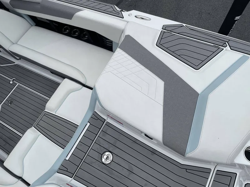 Slide: The Image of Interior of 2022 Nautique G25 with gray and white upholstery. - 6