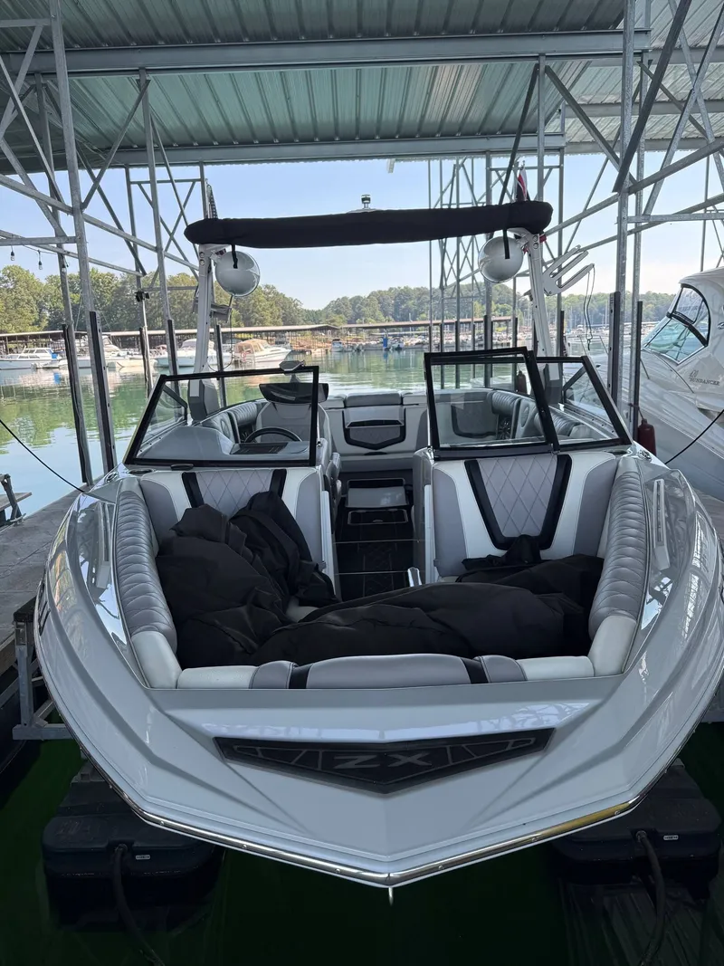 Slide: The Image of 2019 Tigé ZX1 boat docked, featuring modern design. - 4