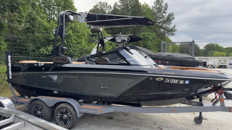 The Image of 2022 Nautique Super Air Nautique GS20 on trailer, side view. - 1