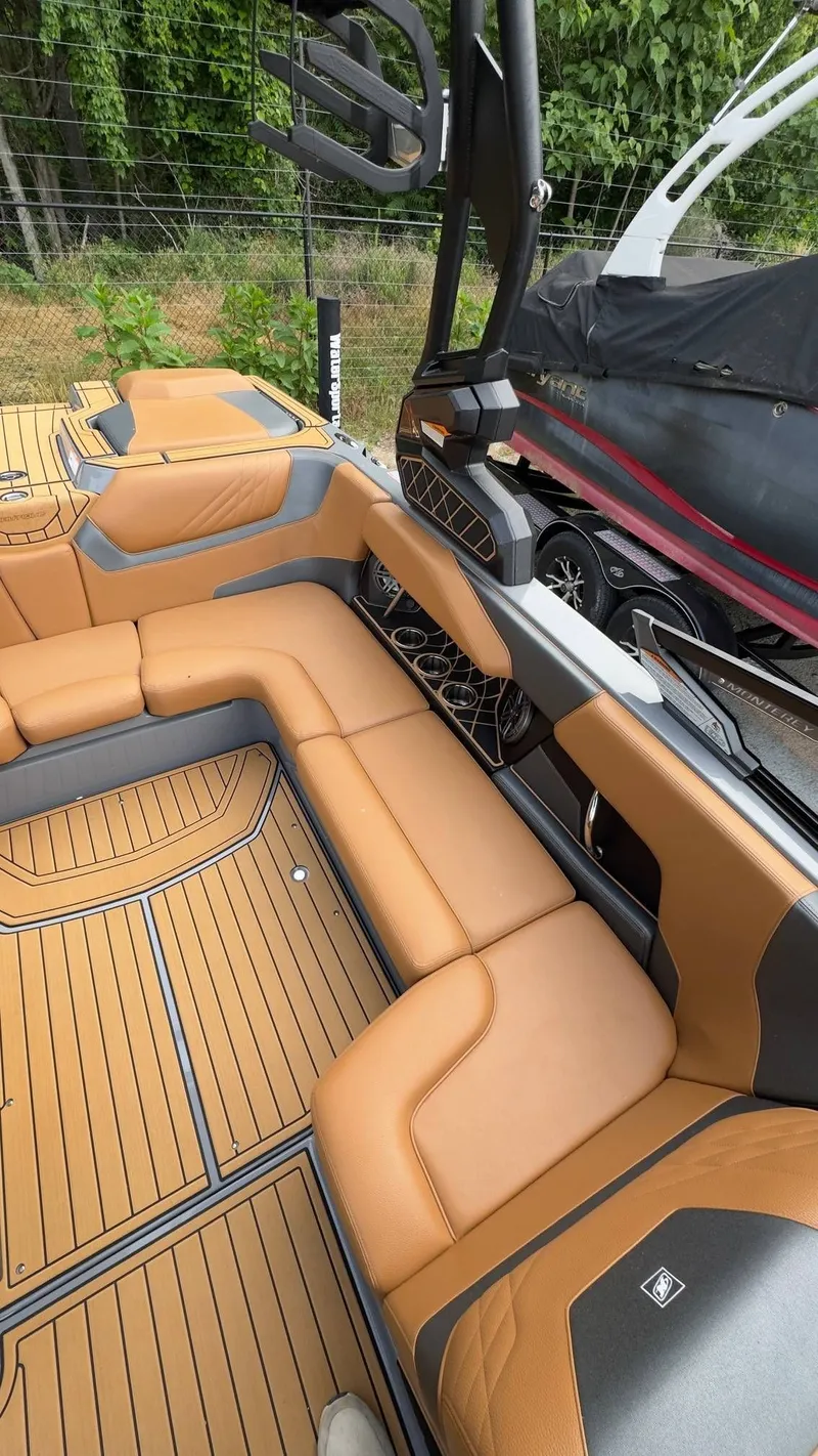 Slide: The Image of Interior of 2022 Nautique Super Air Nautique GS20 with brown leather seating. - 8