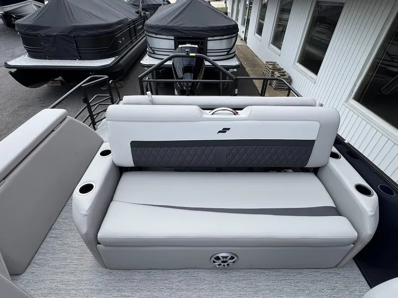 Slide: The Image of Starcraft SLS-5 Q DH 2026 boat with gray seating and cup holders. - 10