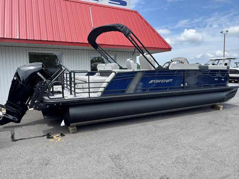 Slide: The Image of 2026 Starcraft SLS-5 Q DH pontoon boat with red roof background. - 11