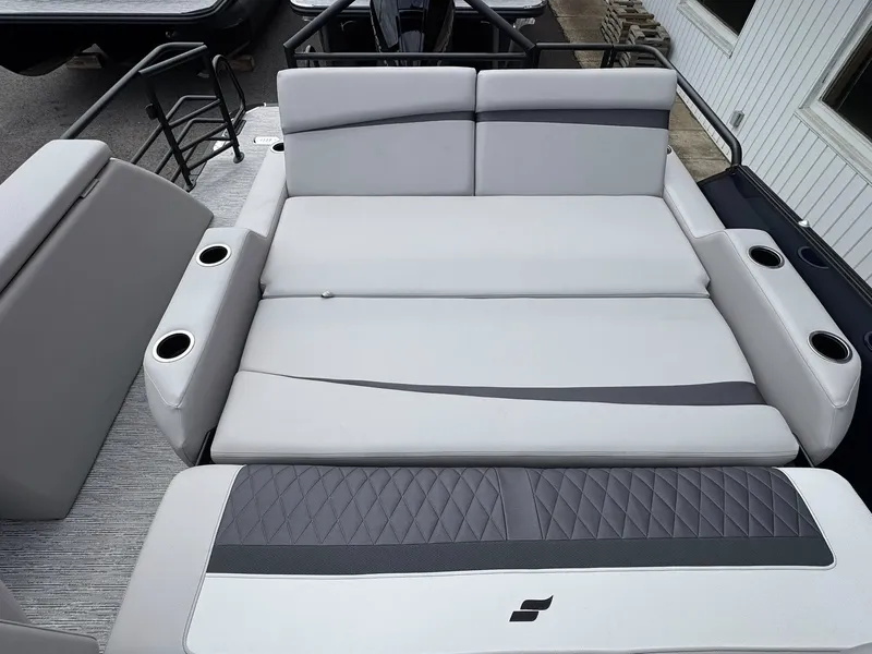Slide: The Image of Starcraft SLS-5 Q DH 2026 boat with gray upholstery and cup holders. - 22