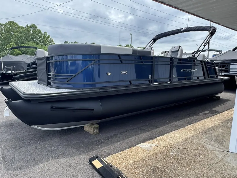 Slide: The Image of 2026 Starcraft SLS-5 Q DH pontoon boat parked outdoors. - 33