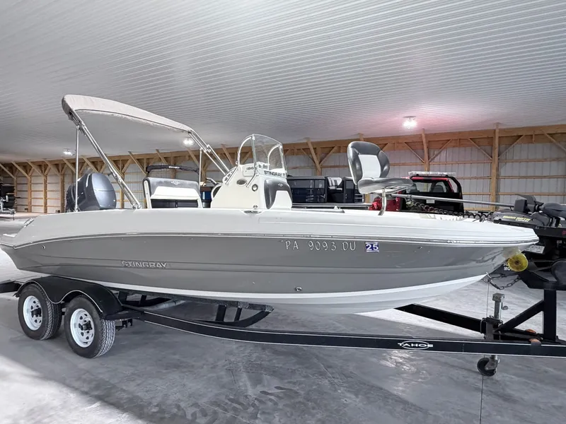 The Image of 2017 Stingray 186 CC boat in warehouse on trailer. - 1