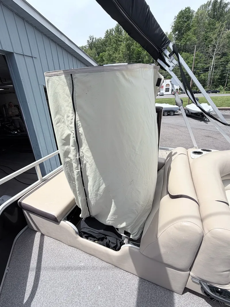 Slide: The Image of 2016 Sun Tracker Party Barge 22 DLX with cover on deck. - 21