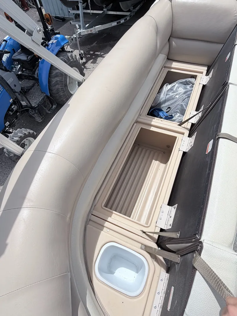 Slide: The Image of Interior view of 2016 Sun Tracker Party Barge 22 DLX with storage compartments. - 23