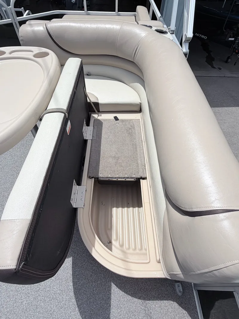 Slide: The Image of Interior of a 2016 Sun Tracker Party Barge 22 DLX with seating. - 4