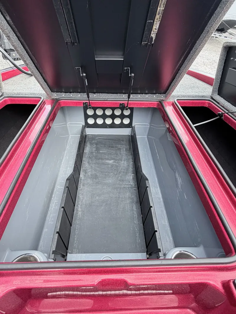 Slide: The Image of Open storage compartment in 2017 Triton 19 TrX boat. - 12