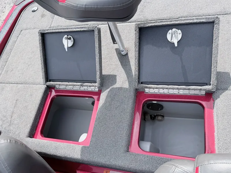 Slide: The Image of 2017 Triton 19 TrX boat with open storage compartments. - 18