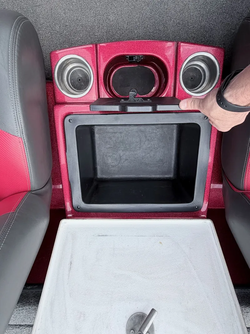 Slide: The Image of Interior of 2017 Triton 19 TrX with cup holders and storage compartment. - 19
