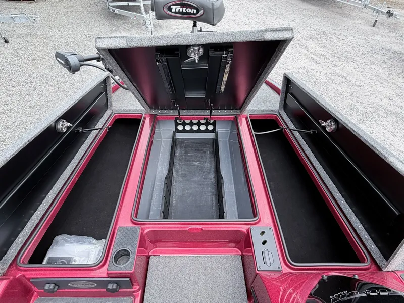 Slide: The Image of Interior view of a 2017 Triton 19 TrX boat with storage compartments. - 3