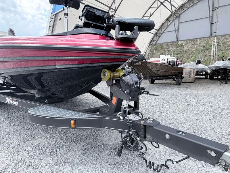 Slide: The Image of 2017 Triton 19 TrX boat on trailer in storage facility. - 32