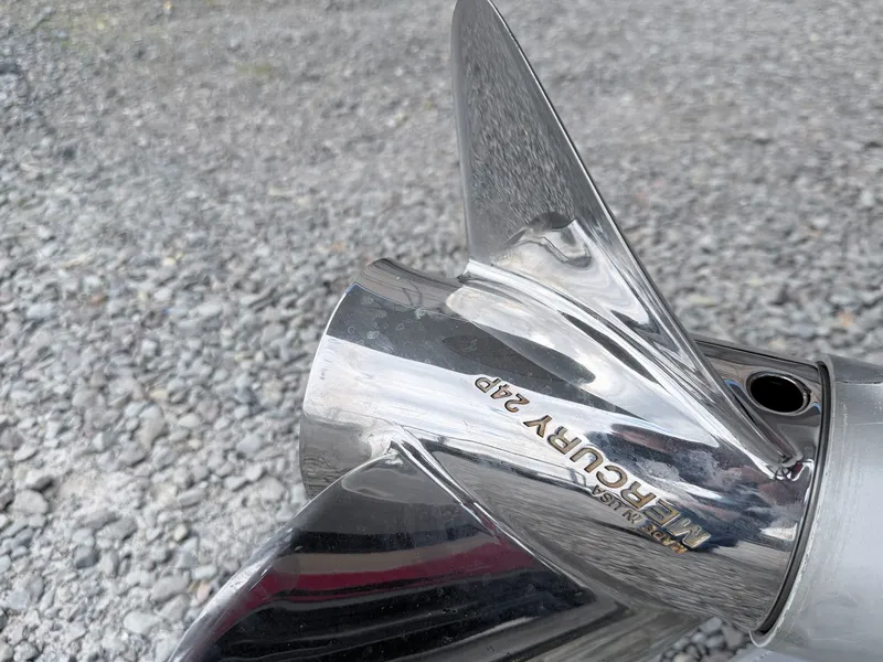 Slide: The Image of Close-up of a Mercury 24P propeller on gravel. - 34