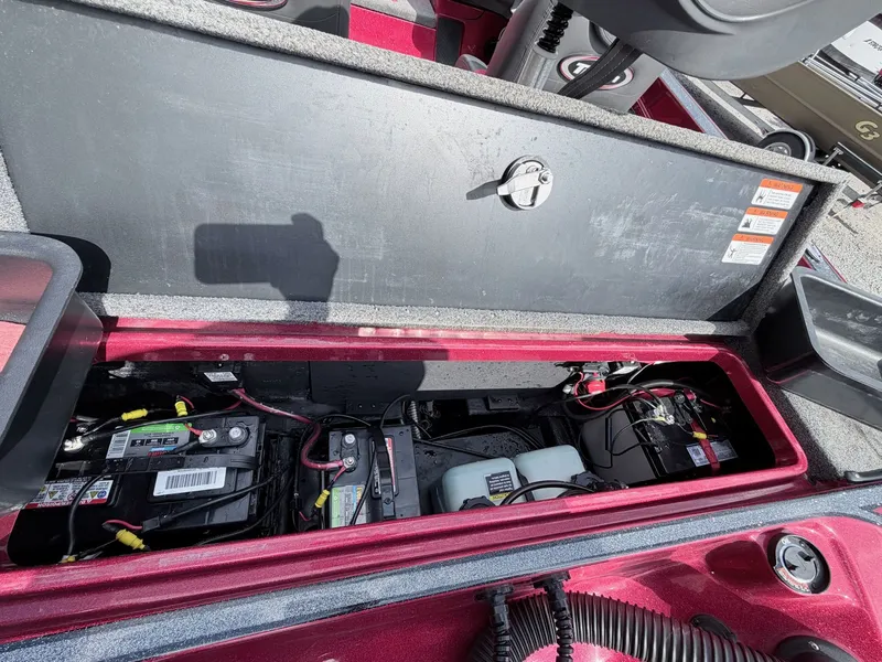 Slide: The Image of Battery compartment of a 2017 Triton 19 TrX boat, open. - 35