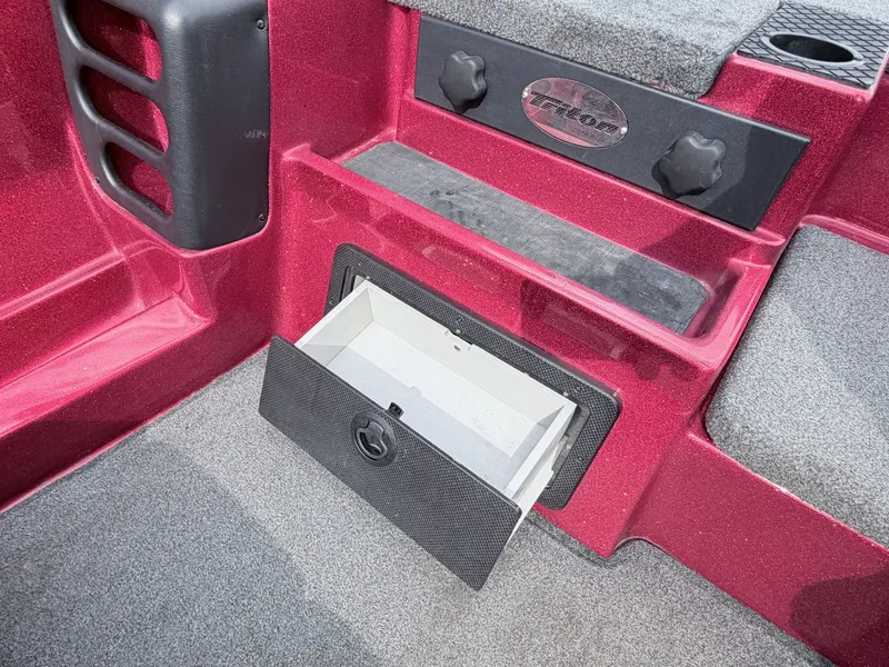 Slide: The Image of Red 2017 Triton 19 TrX boat with open storage compartment. - 37