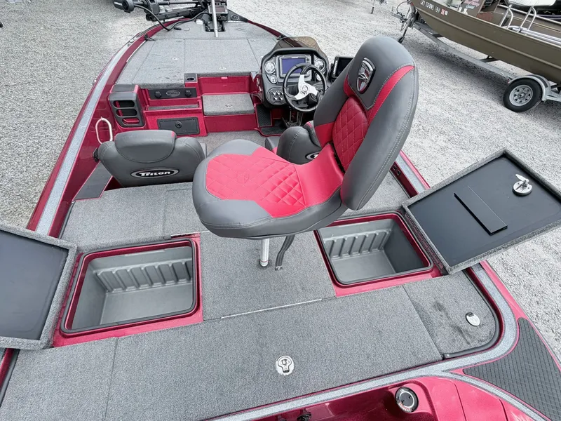 Slide: The Image of 2017 Triton 19 TrX boat with red seat and storage compartments. - 41