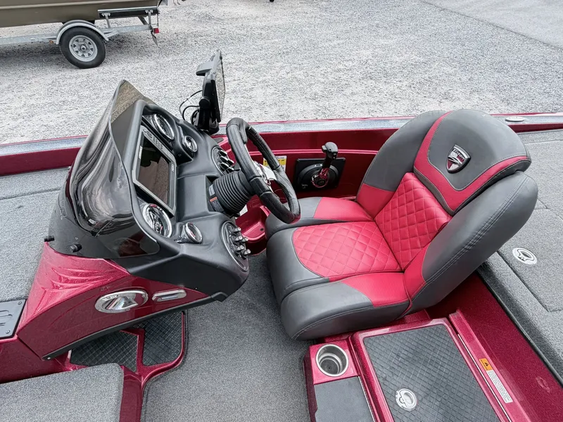 Slide: The Image of Interior of a 2017 Triton 19 TrX boat with red seat. - 42