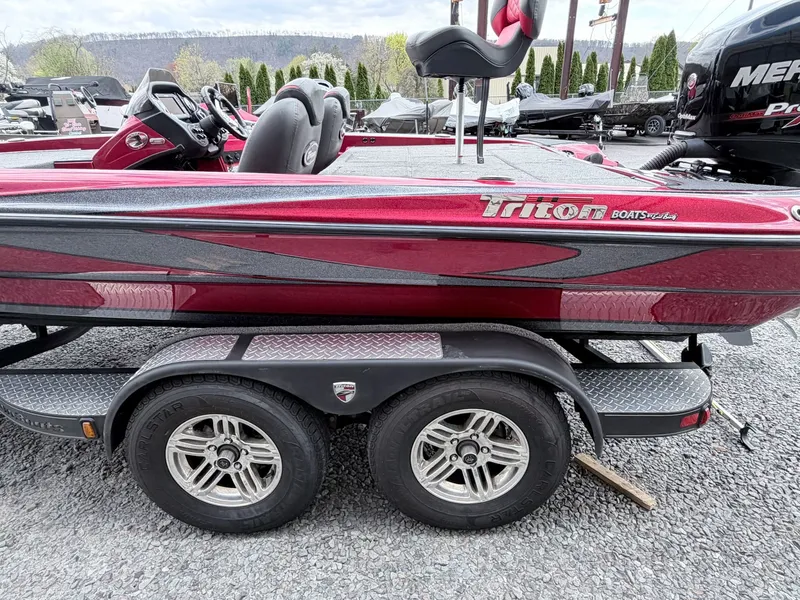 Slide: The Image of 2017 Triton 19 TrX boat on trailer, red color, side view. - 5